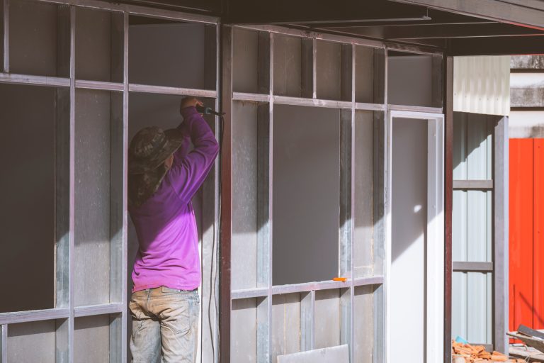 asian-construction-worker-installing-precast-conc-2022-11-04-23-47-57-utc