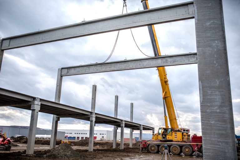 Close up details of construction site, industrial crane working in civil engineering